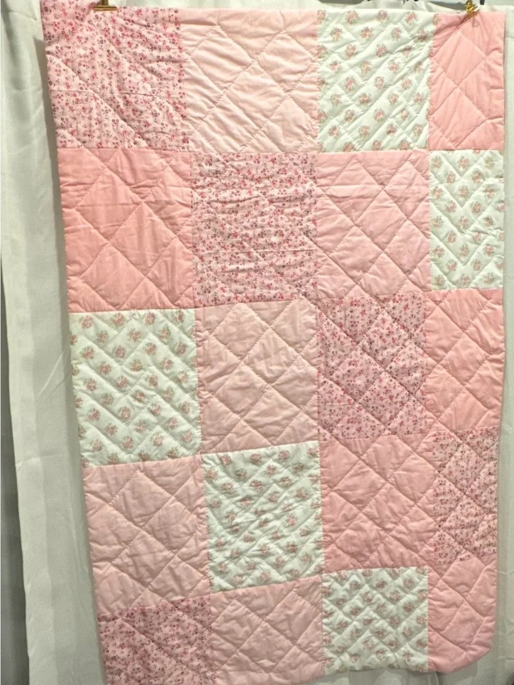 Handmade Pink Patchwork Quilt for your babies crib or toddler bed.