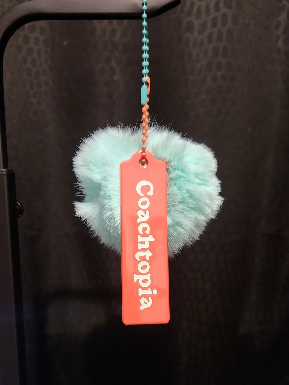 Coachtopia Coral Tag with Aqua Fur Pom-Pom