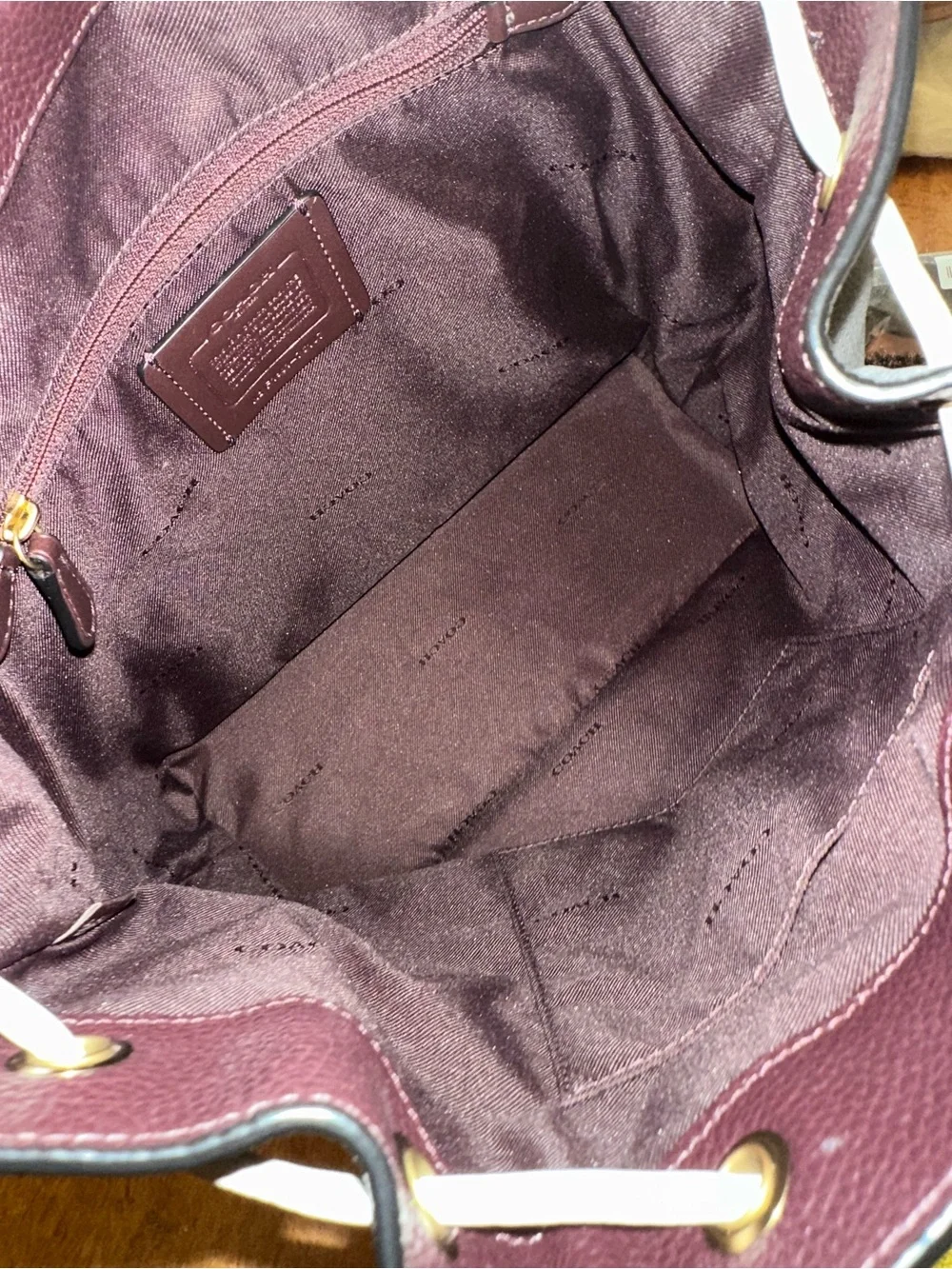 Coach polished pebble