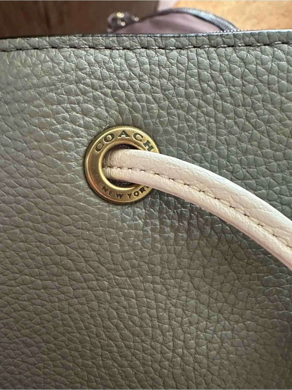 Coach polished pebble