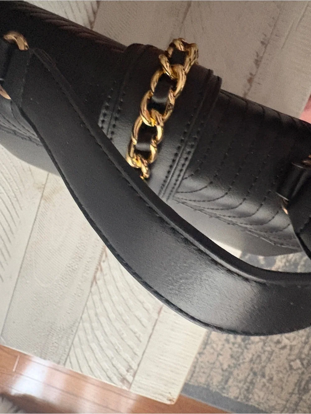 Black Quilted Leather Top-Handle Bag with Gold Chain Accent