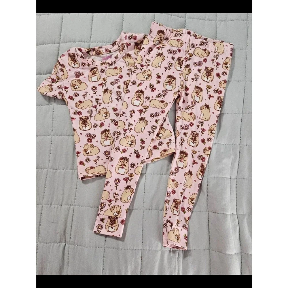Penelope Mack,  pink capybaras and floral Pjs