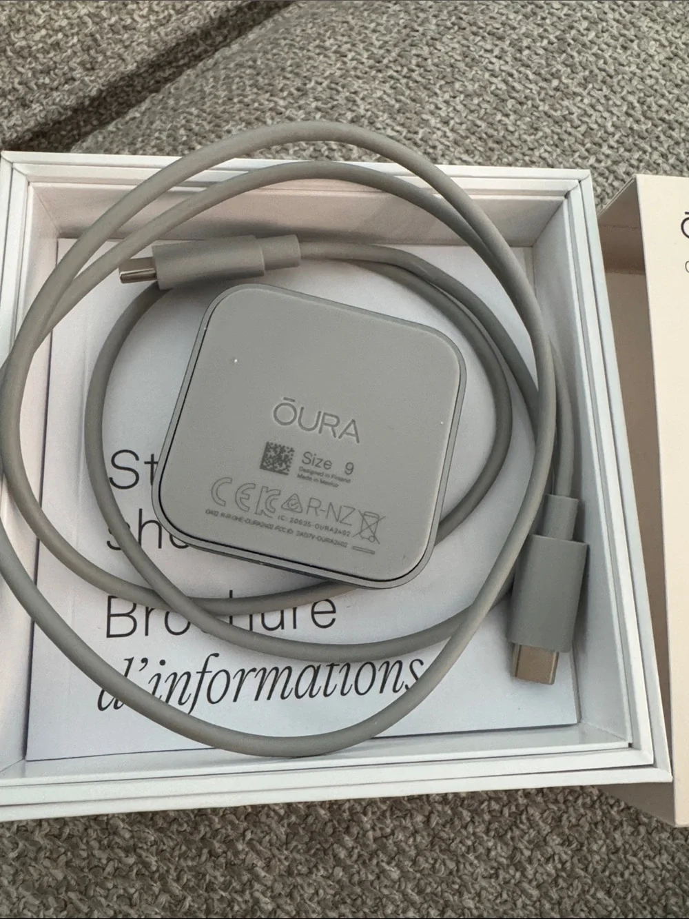 Oura Ring 4 Charging Dock and USB-C Cable in Light Gray