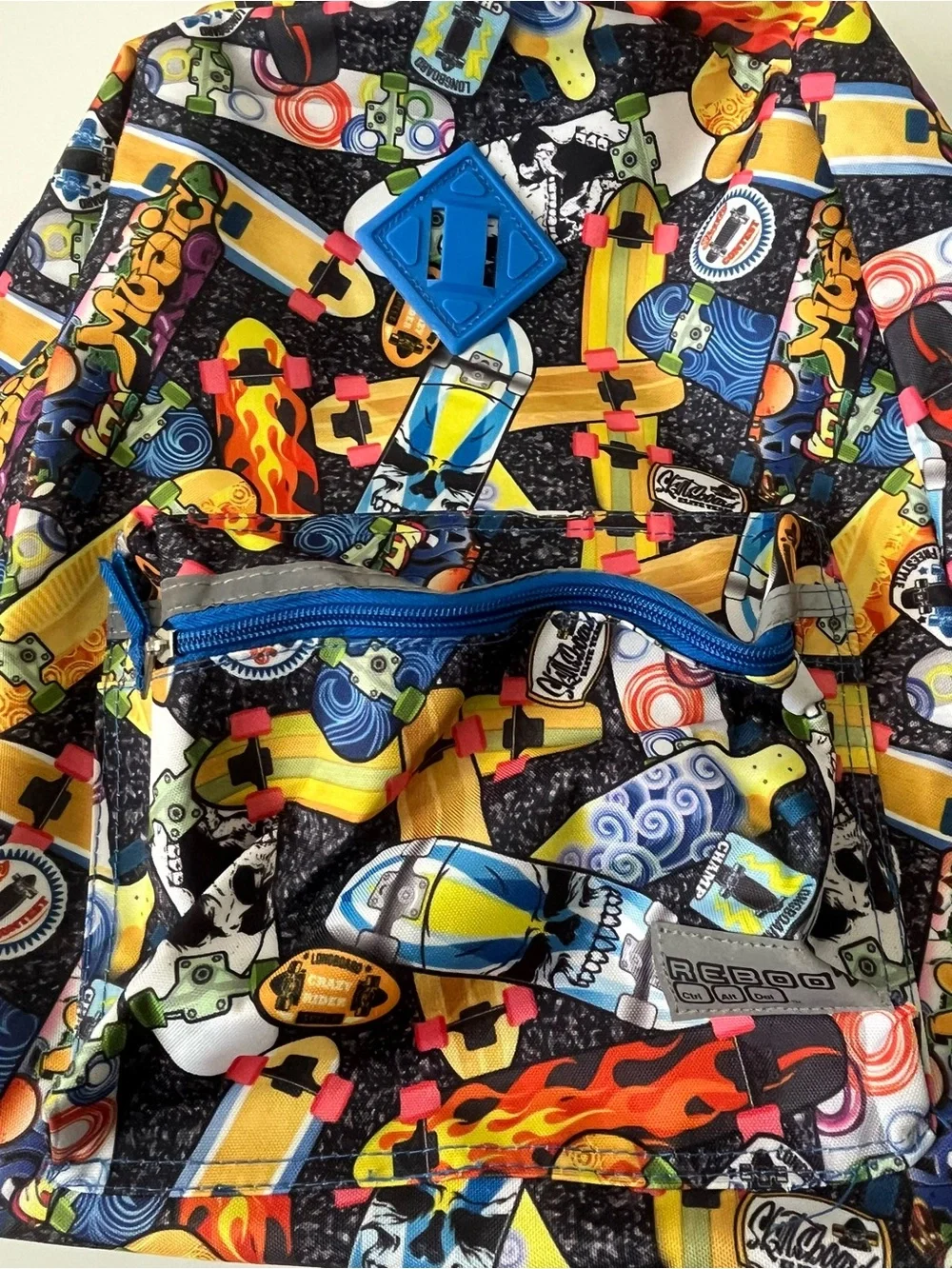 This Reboot Kids Blue Multi-Print Backpack - Fun Skateboard Pattern