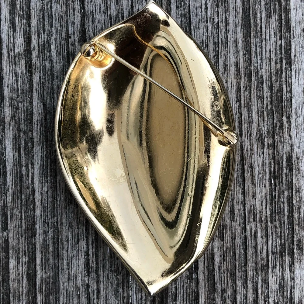 Trifari brooch… see