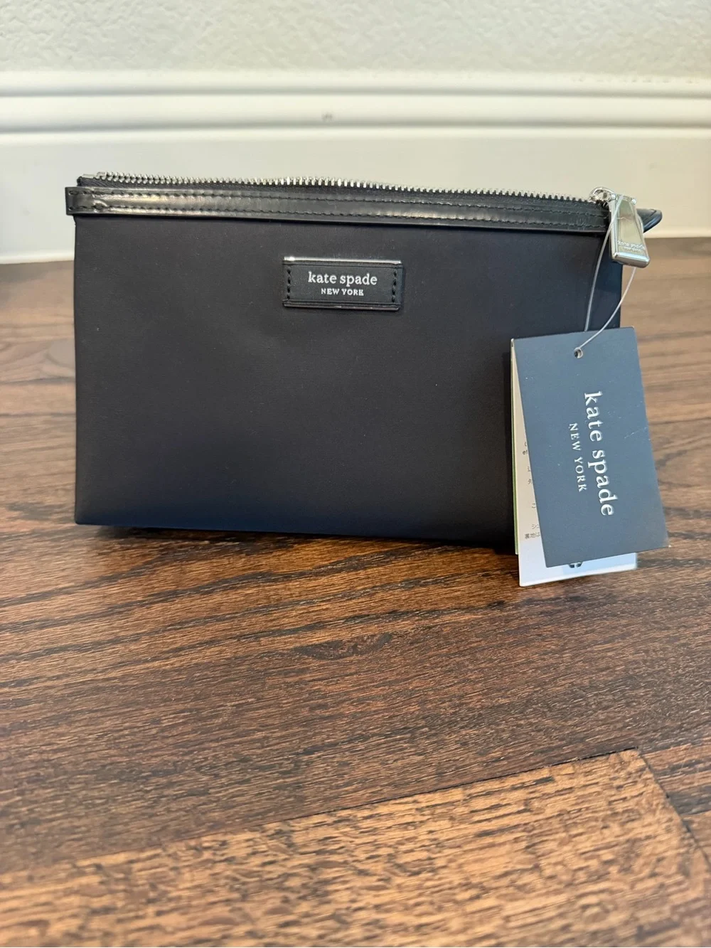 kate spade black toiletry pouch with zip-top