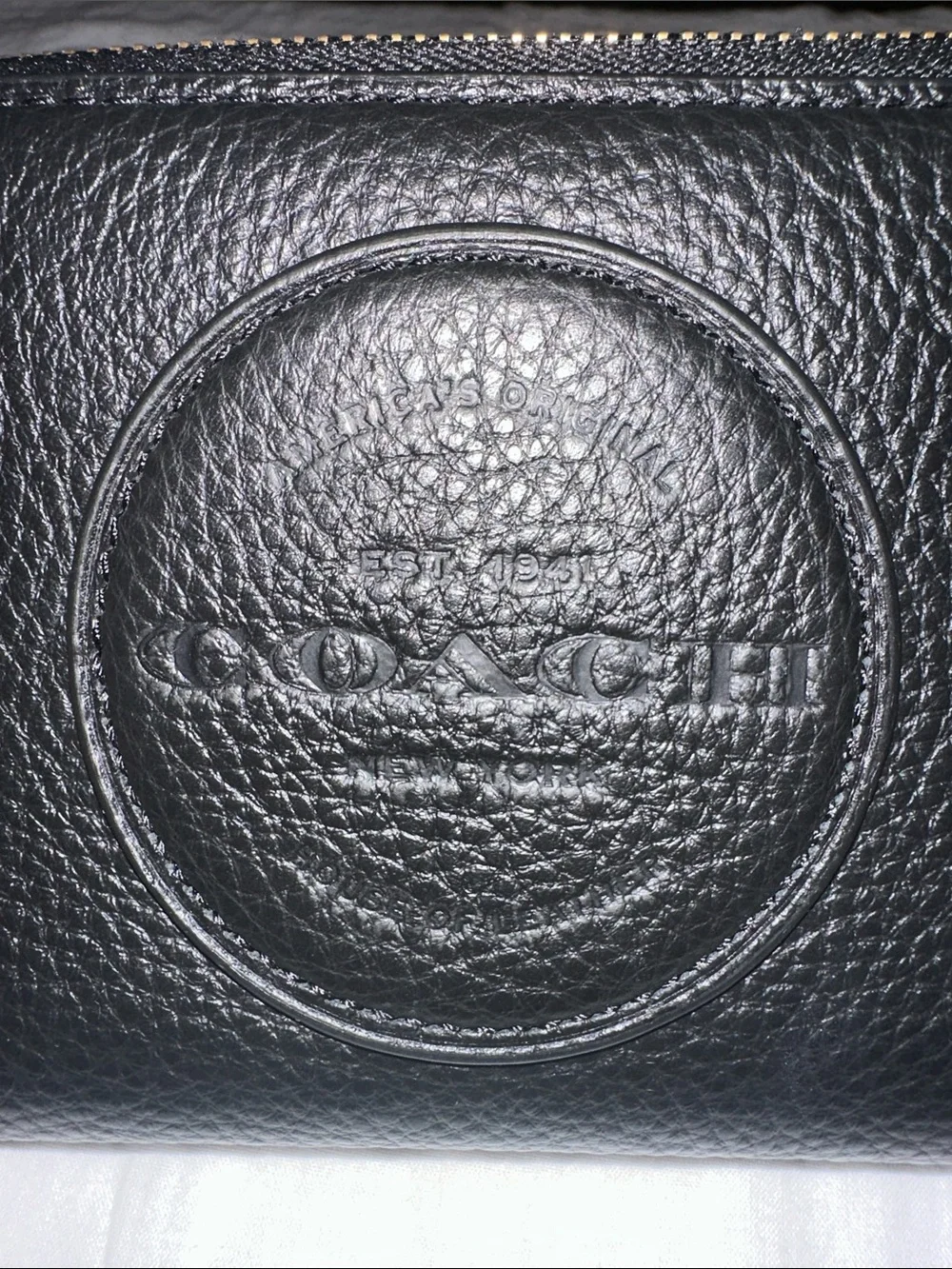 Coach hand logo