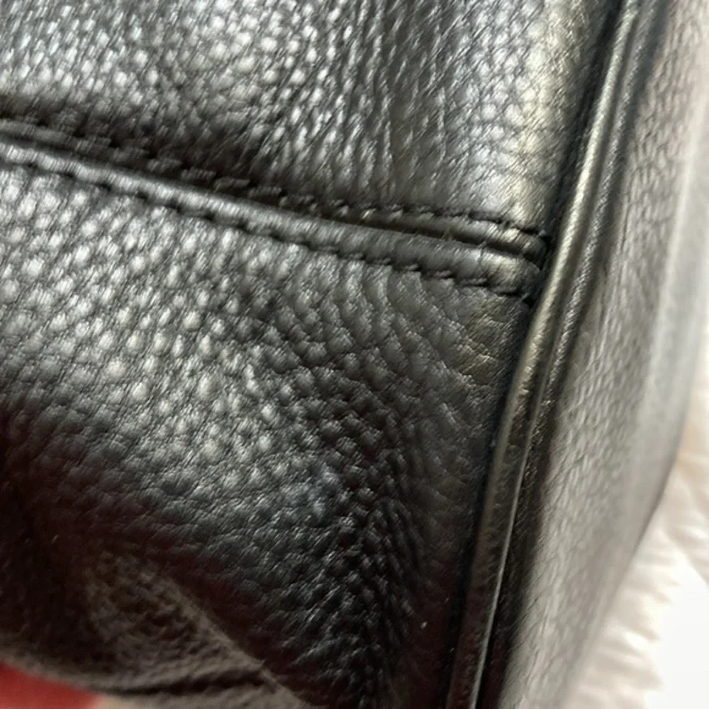 Michael Kors scuffs light around
