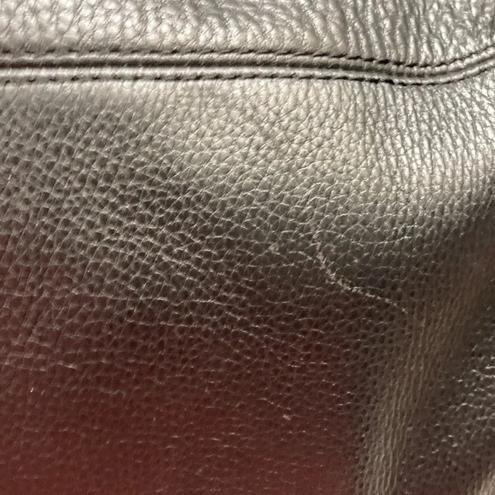 Michael Kors darkened scuffs light