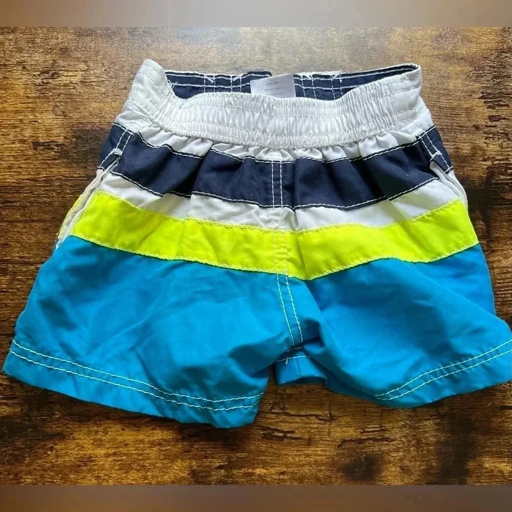 SET: Baby boy, Carter’s swim trunks + jumping beans. Size: 12M​