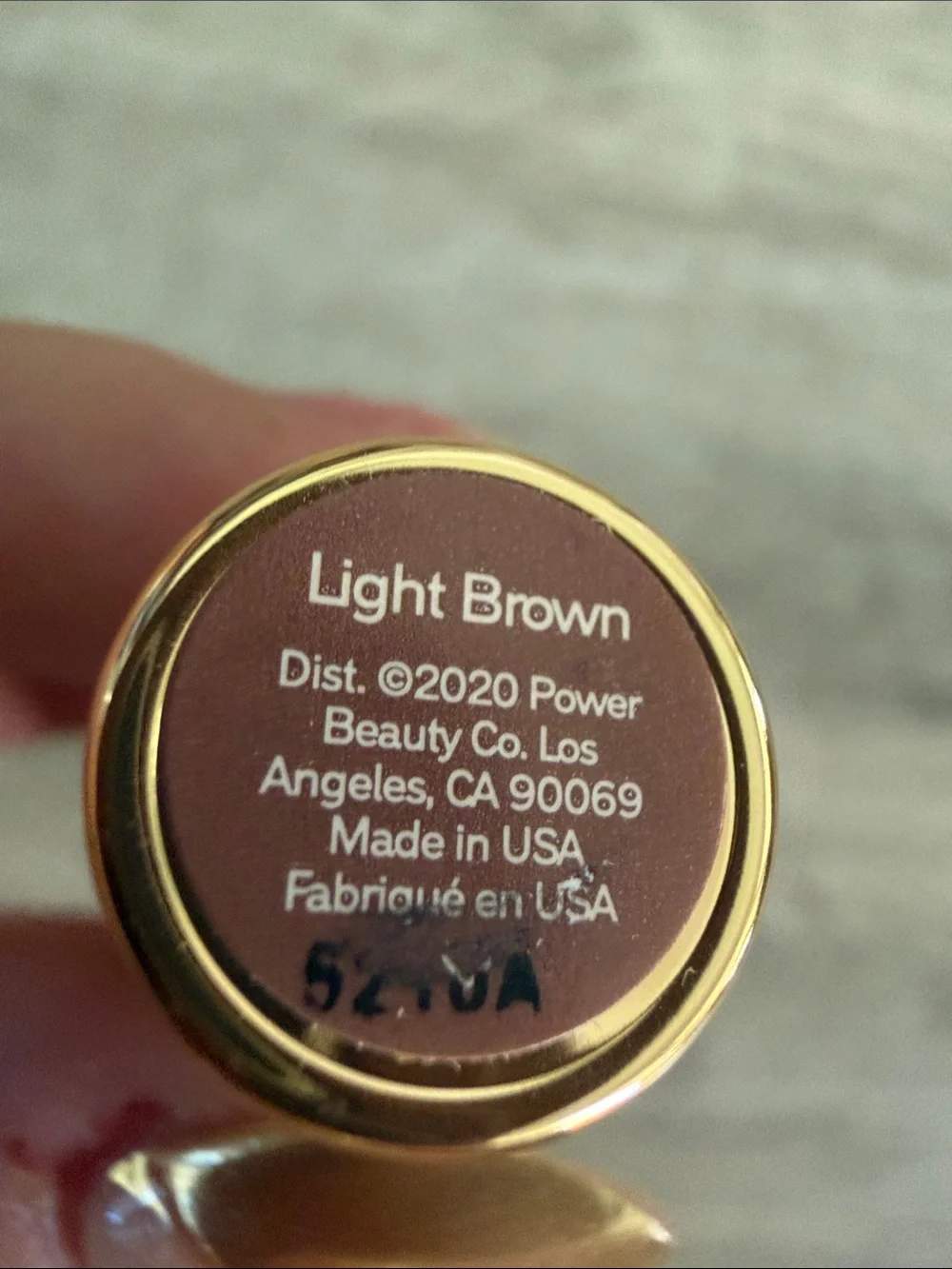 MERIT Volumizing Brow Pomade in light brown