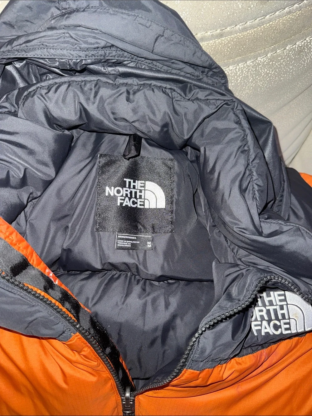 The North Face Men’s Orange and Black Puffer Jacket