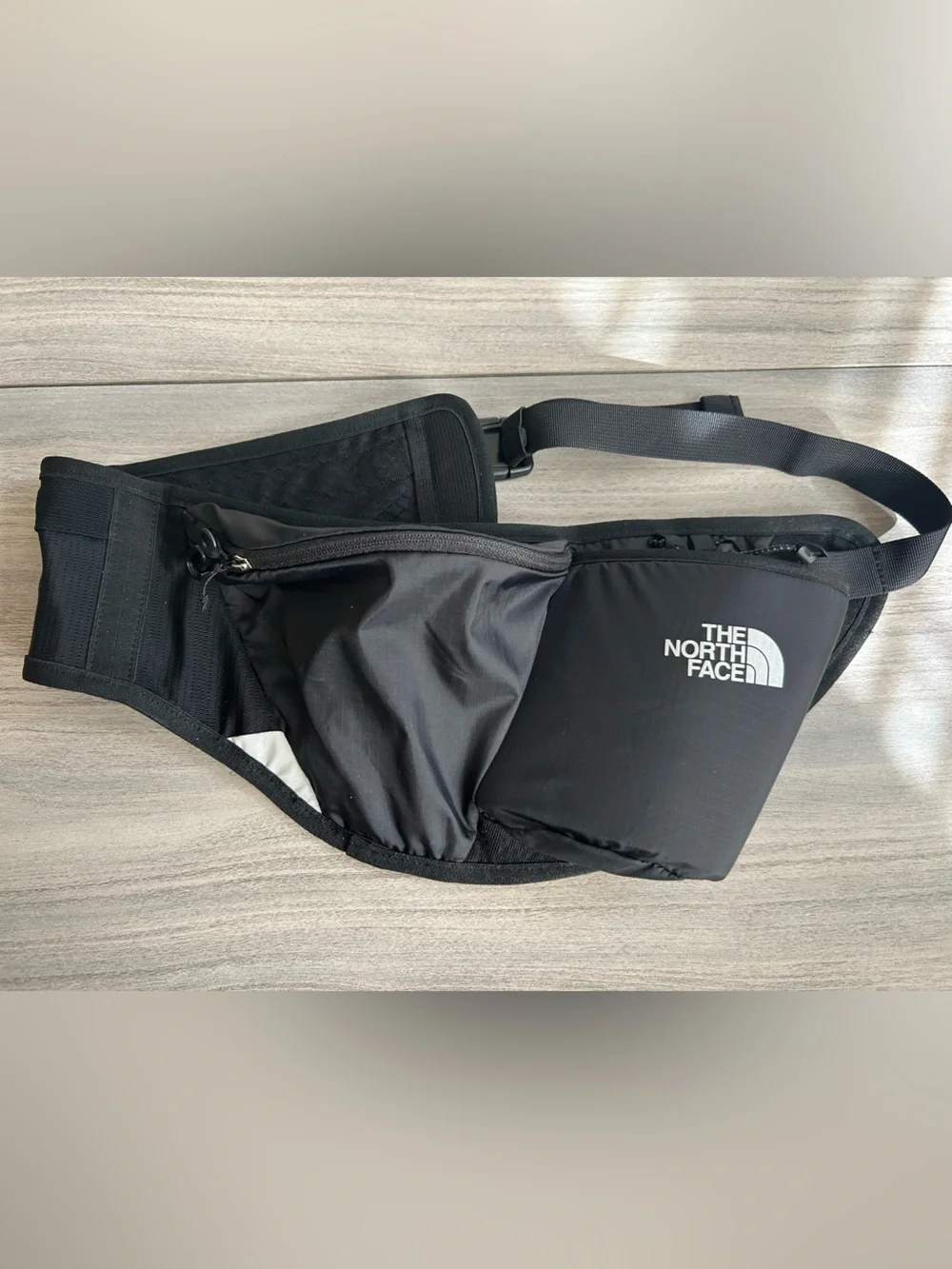 The North Face Black Sling Belt Bag with White Logo