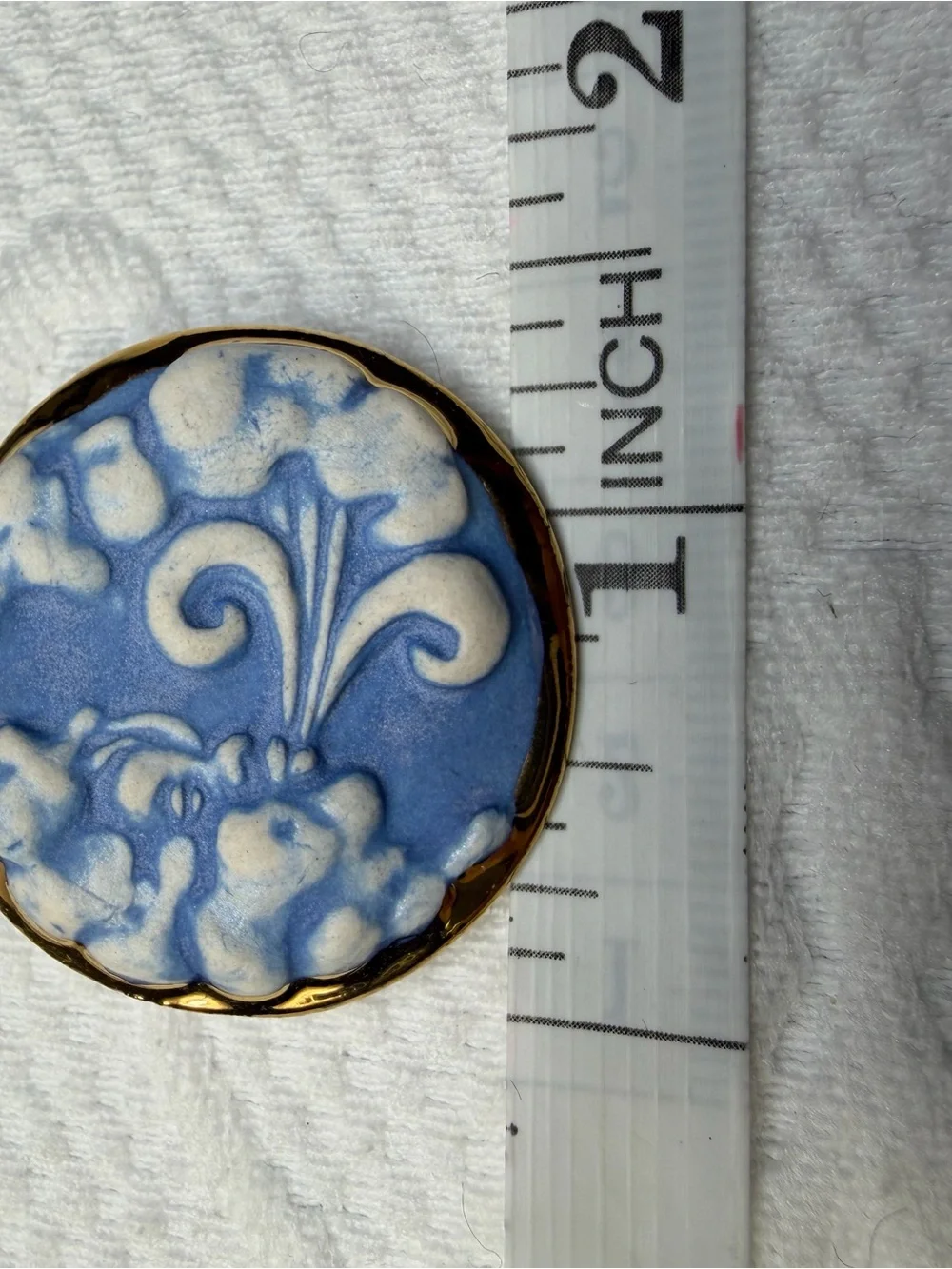 Blue and Cream Wind Face Ceramic Pin with Gold Trim