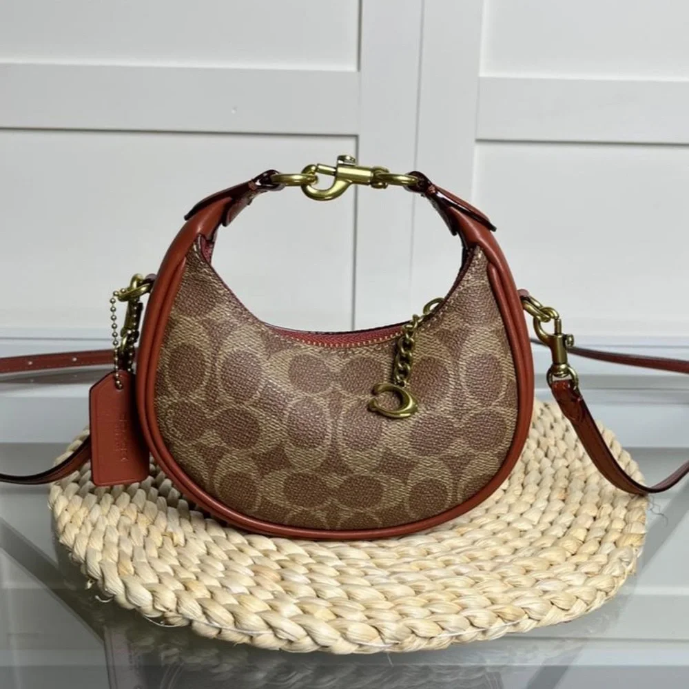 Coach Brown Signature Crescent Shoulder Bag with Rust Trim