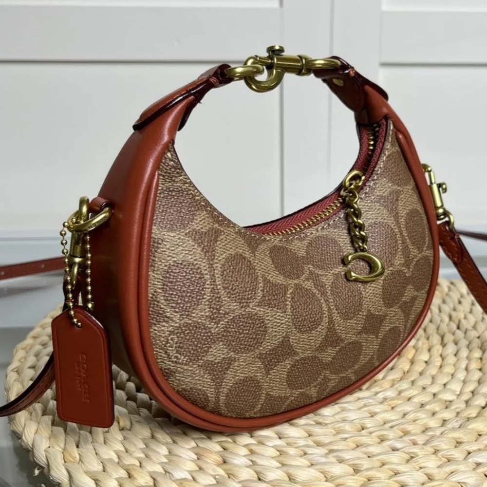 Coach Brown Signature Crescent Shoulder Bag with Rust Trim