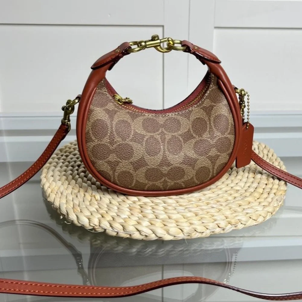 Coach Brown Signature Crescent Shoulder Bag with Rust Trim