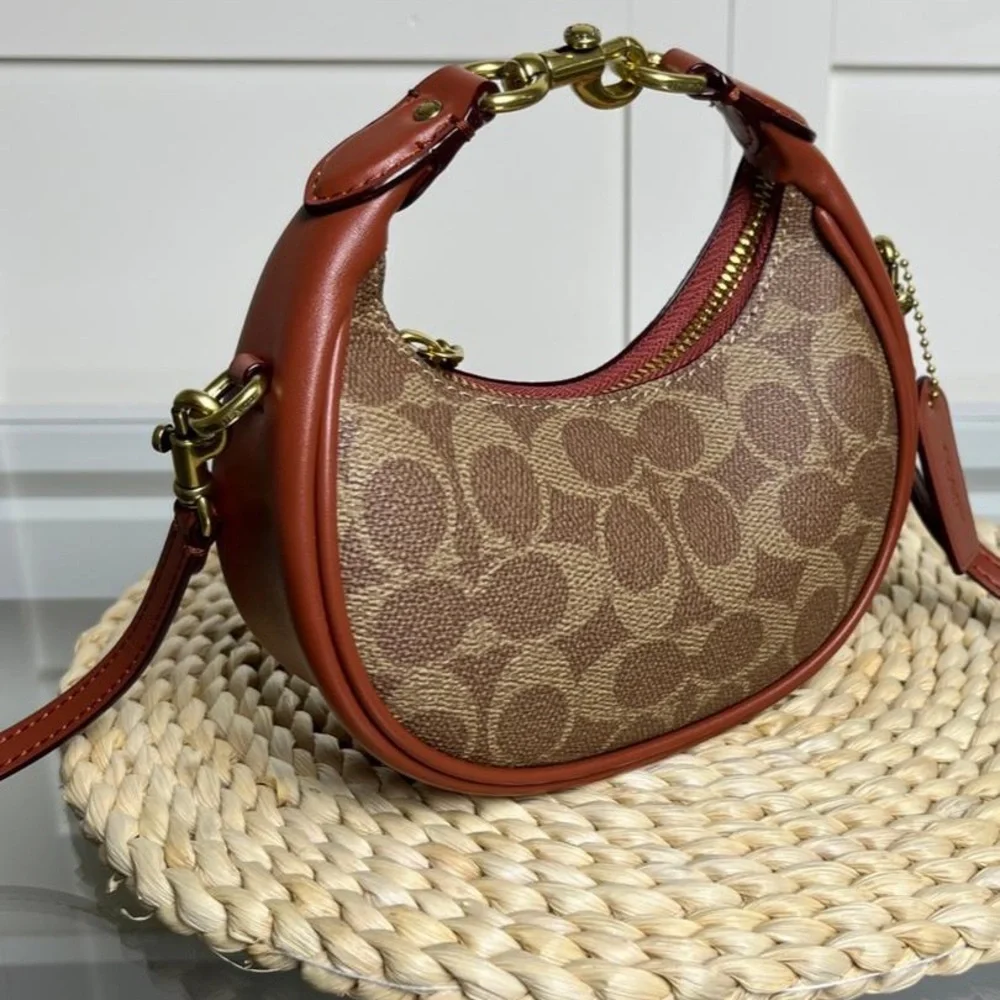Coach Brown Signature Crescent Shoulder Bag with Rust Trim
