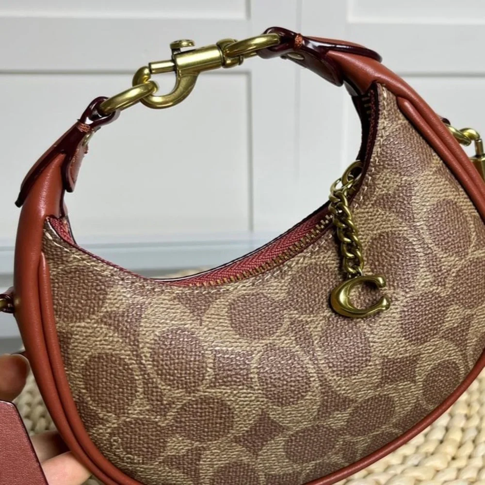 Coach Brown Signature Crescent Shoulder Bag with Rust Trim