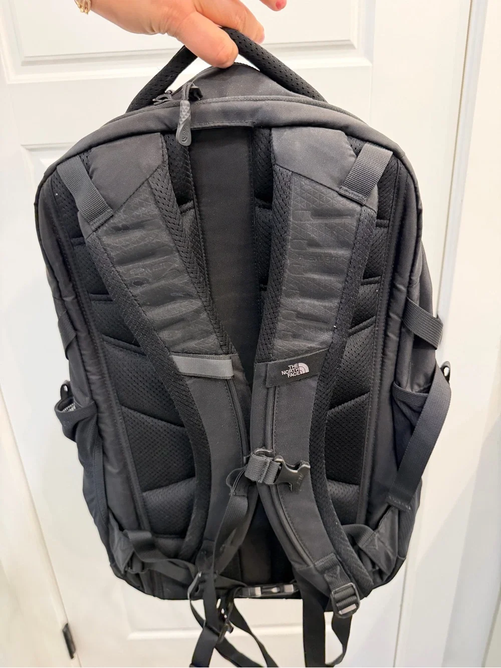 The North Face Black Backpack with Front Pocket and Buckle Straps