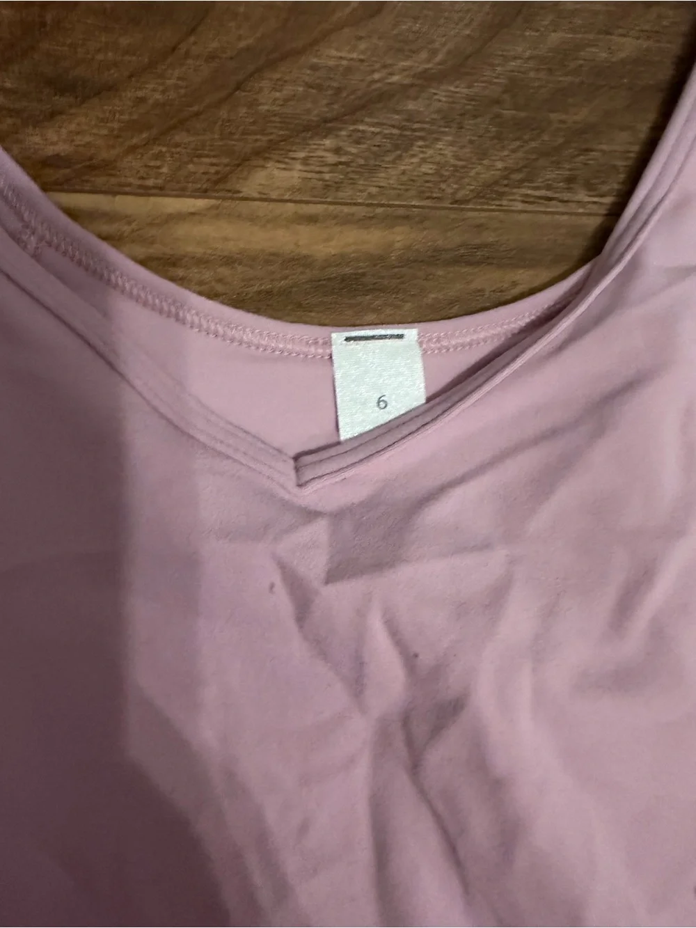 NEVER WORN PINK TANK TOP LULULEMON SIZE 6 but fits like a 4