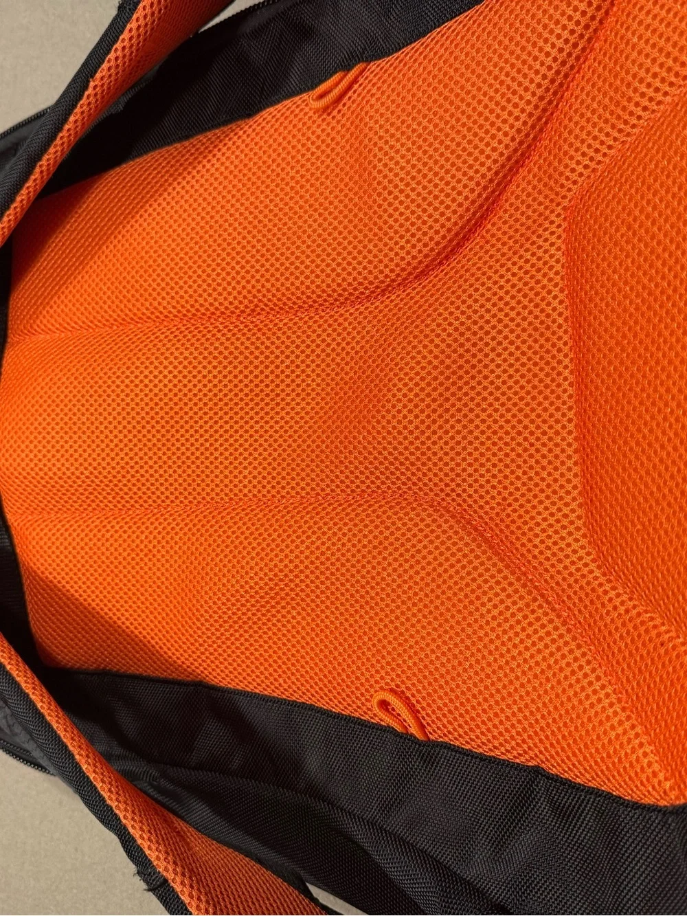Black Men's Travel Backpack with Orange Accents Everki large laptop bag.