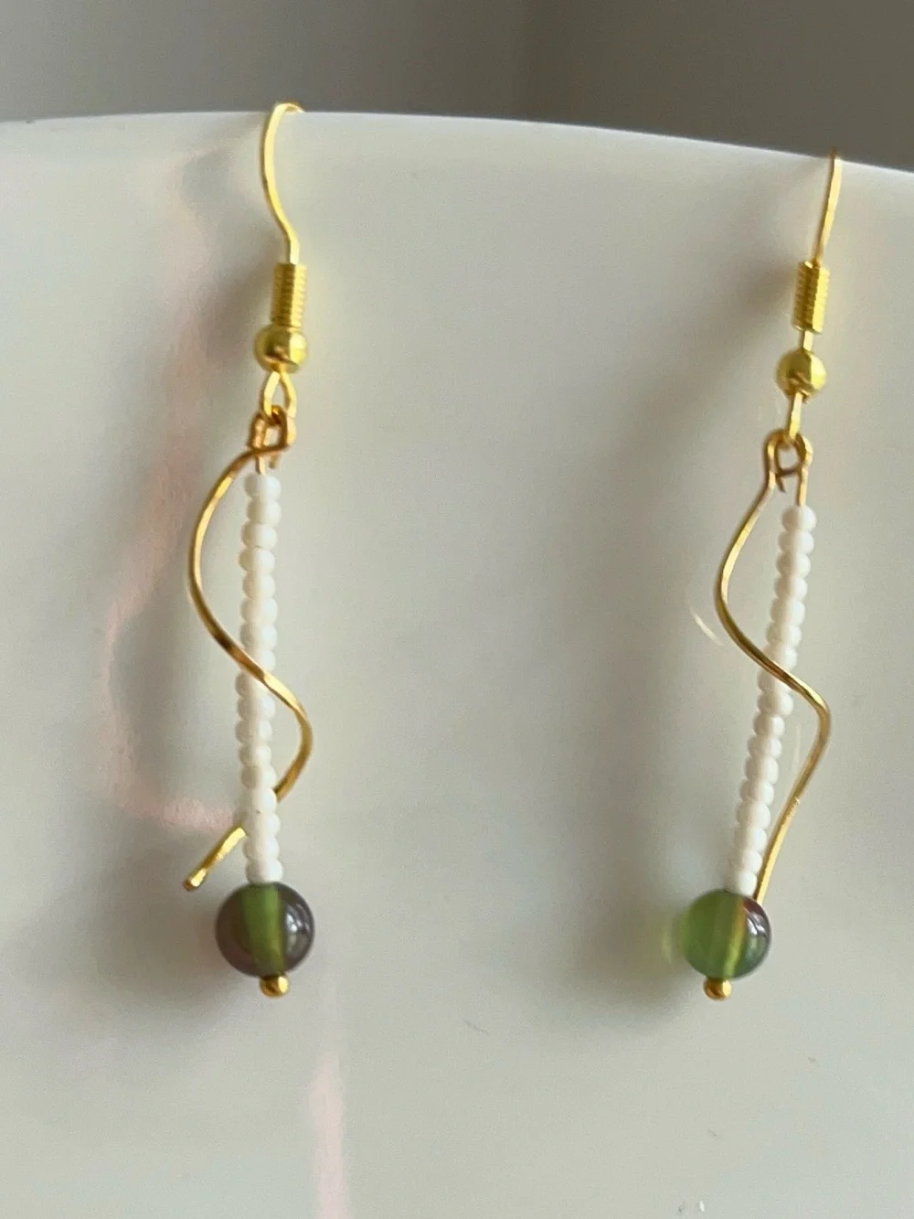 Dainty Drop Gold-toned Wavy Metal Design Adorned | White & Olive Grean Jade Bead