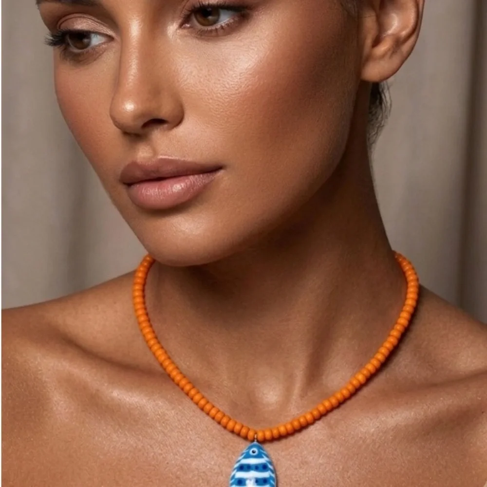 Orange Beaded Necklace with Blue Fish Charm