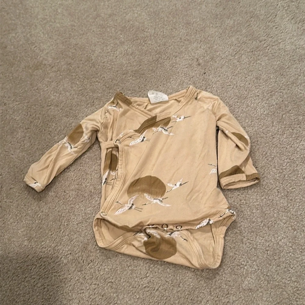 Kate Quinn bird bodysuit