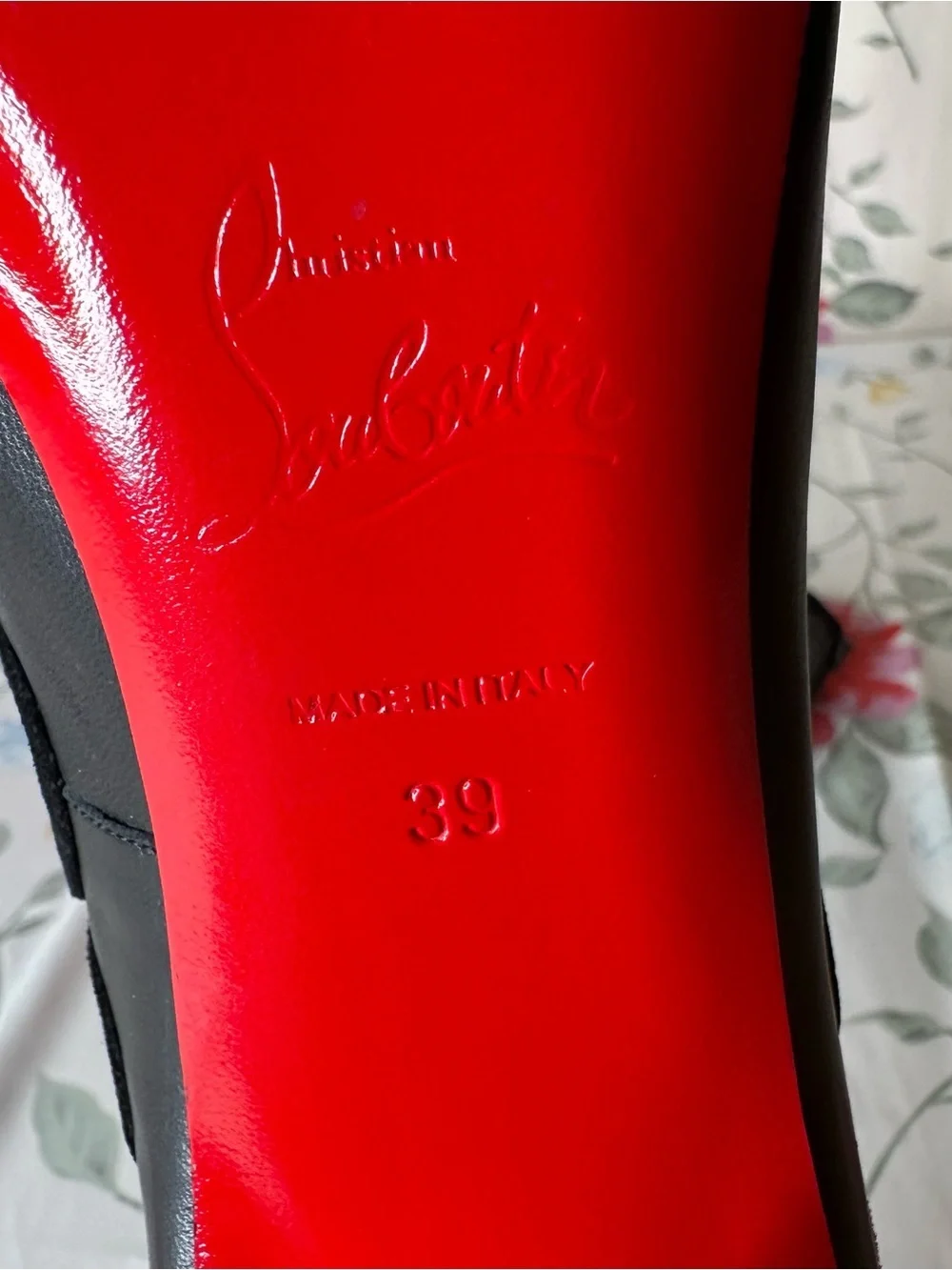 Christian Louboutin signature slightly