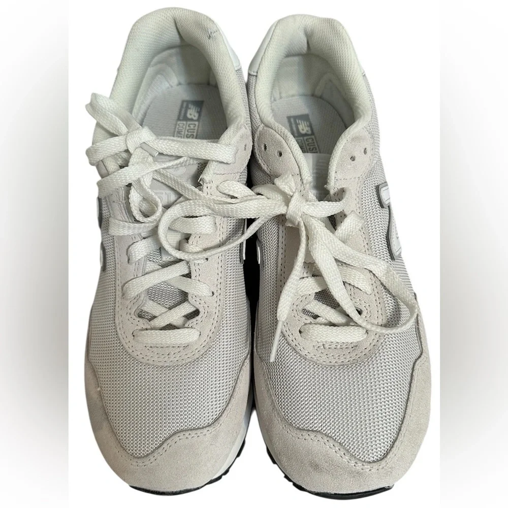 New Balance Grey / White athletic sneakers.
