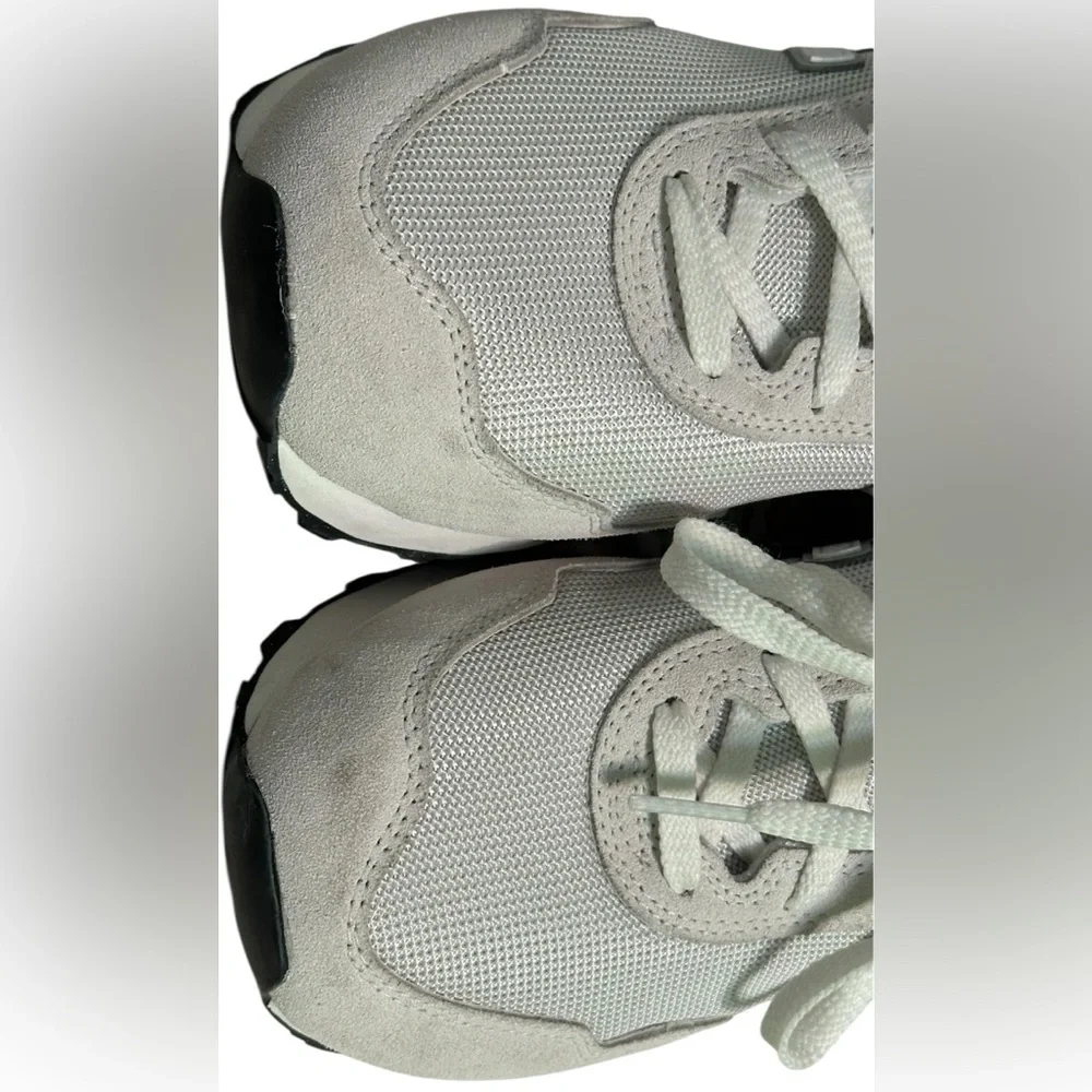 New Balance Grey / White athletic sneakers.