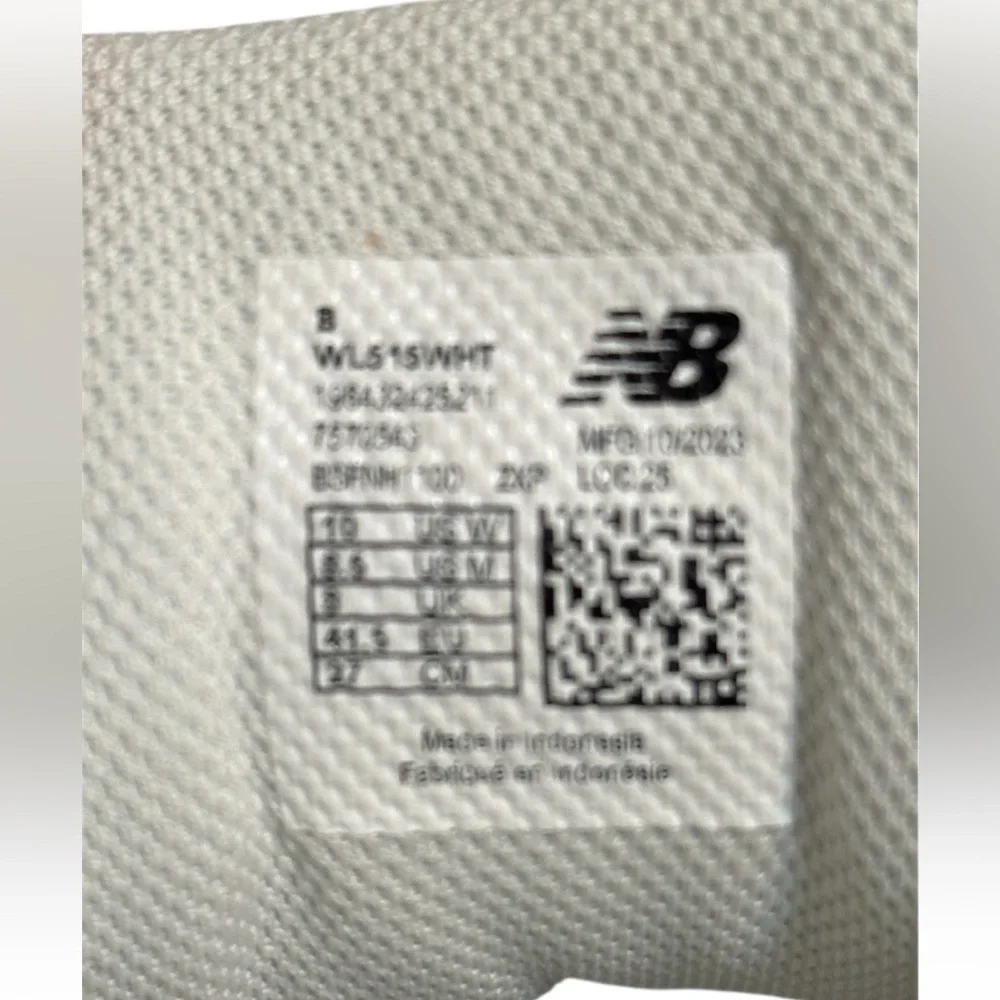 New Balance Grey / White athletic sneakers.
