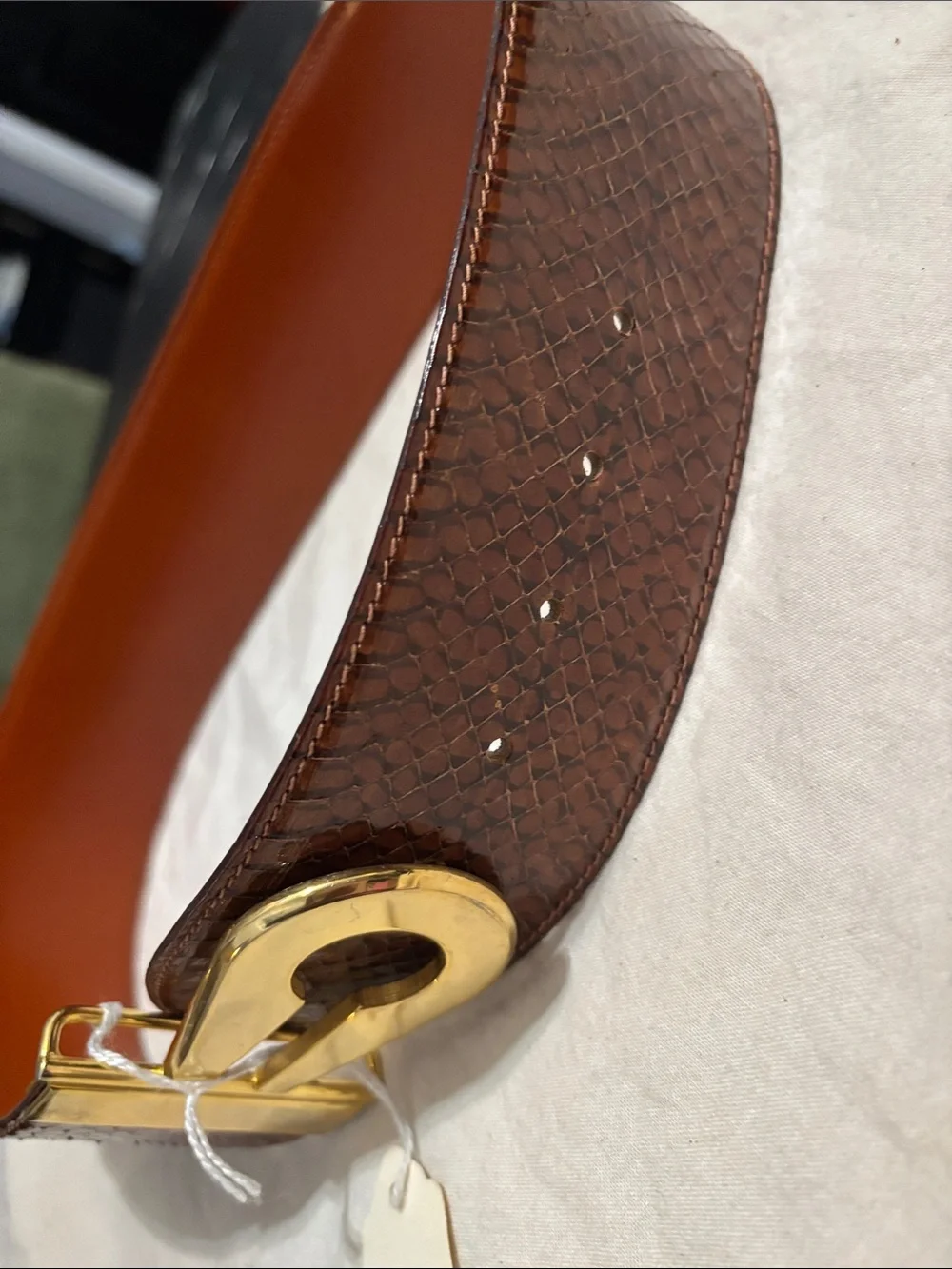 Source Unknown sleek brown
