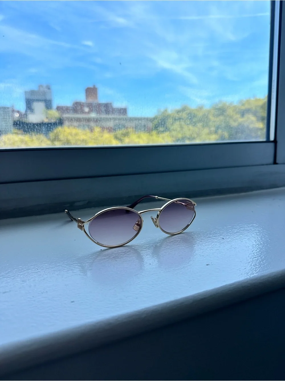 Miu Miu Gold Frame Oval Sunglasses with Pink Gradient Lenses
