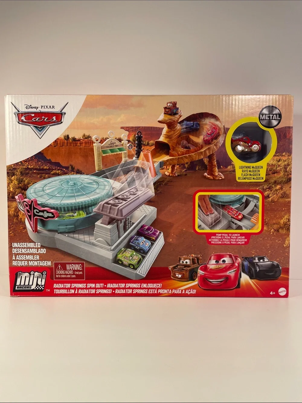 Mini Racers-Cardboard Packaging has dents and a torn spot as shown