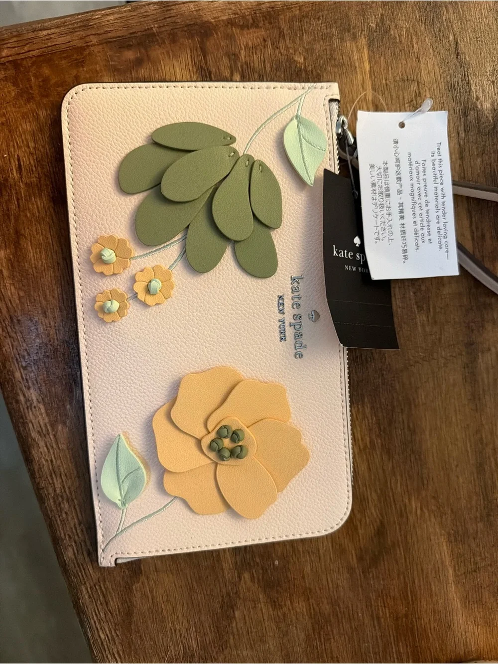 kate spade pale pink zip-around wallet