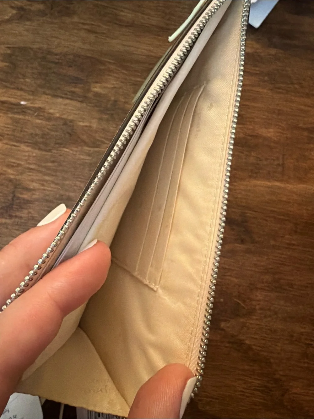 kate spade pale pink zip-around wallet