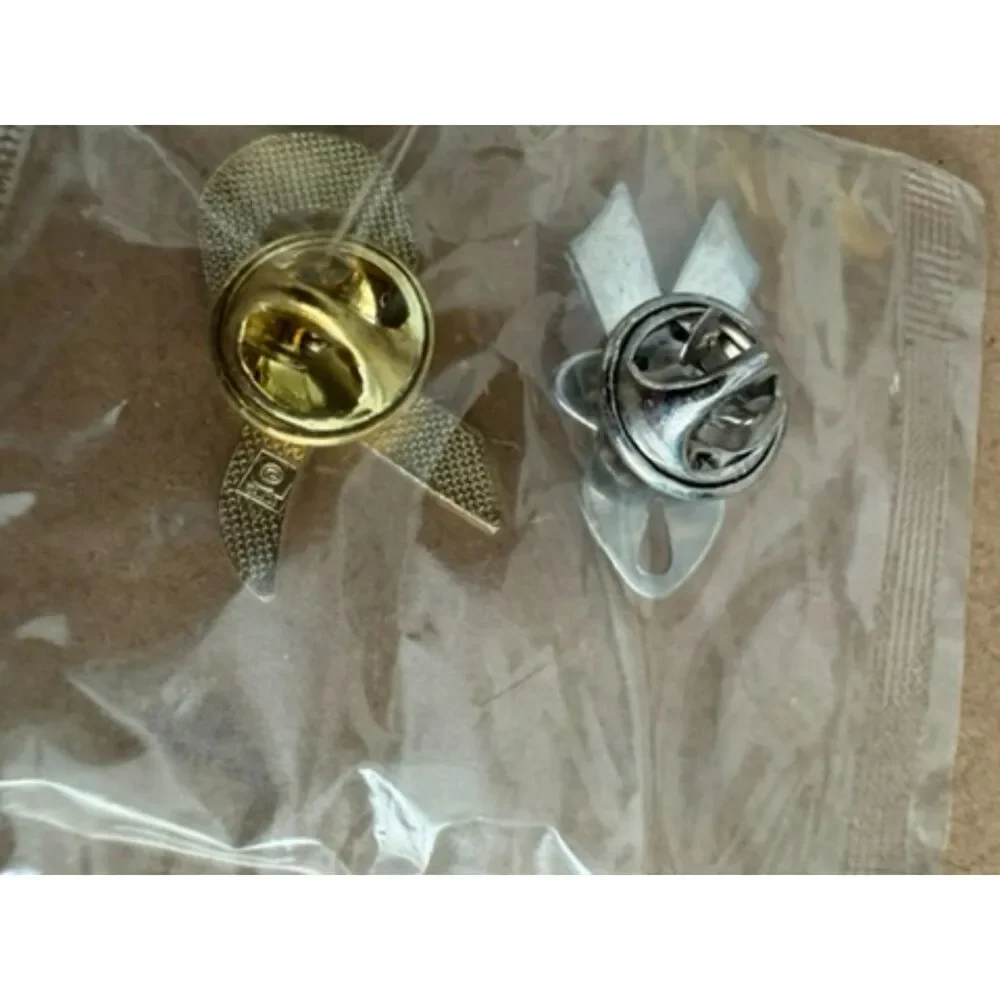 Pink Ribbon label pins one with FORD in center