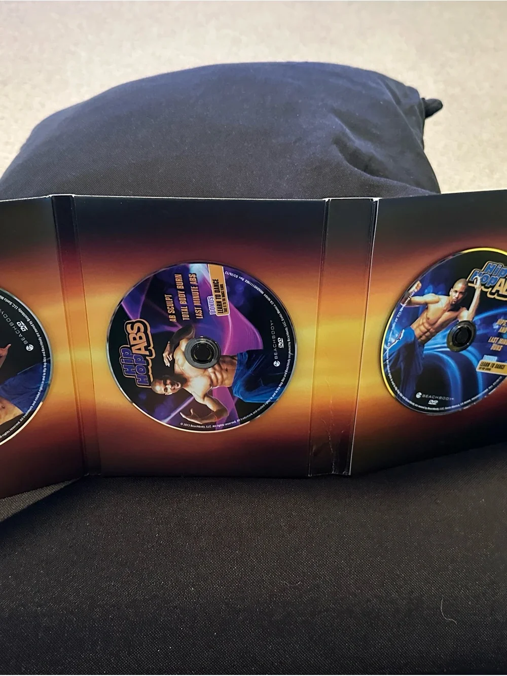 Beachbody Hip Hop Abs DVDs - Black and Blue Cover Art