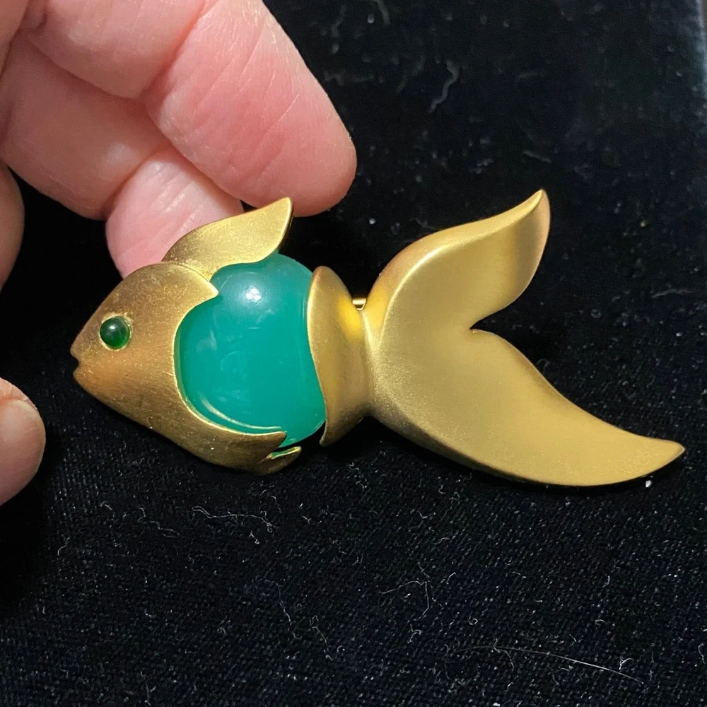 Givenchy vintage Matt gold tone with faux jade belly and eye brooch