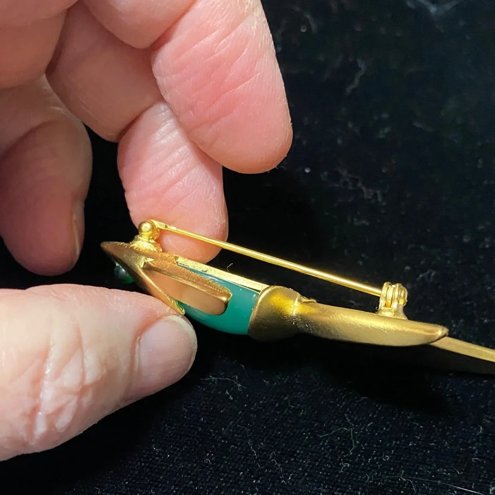 Givenchy vintage Matt gold tone with faux jade belly and eye brooch