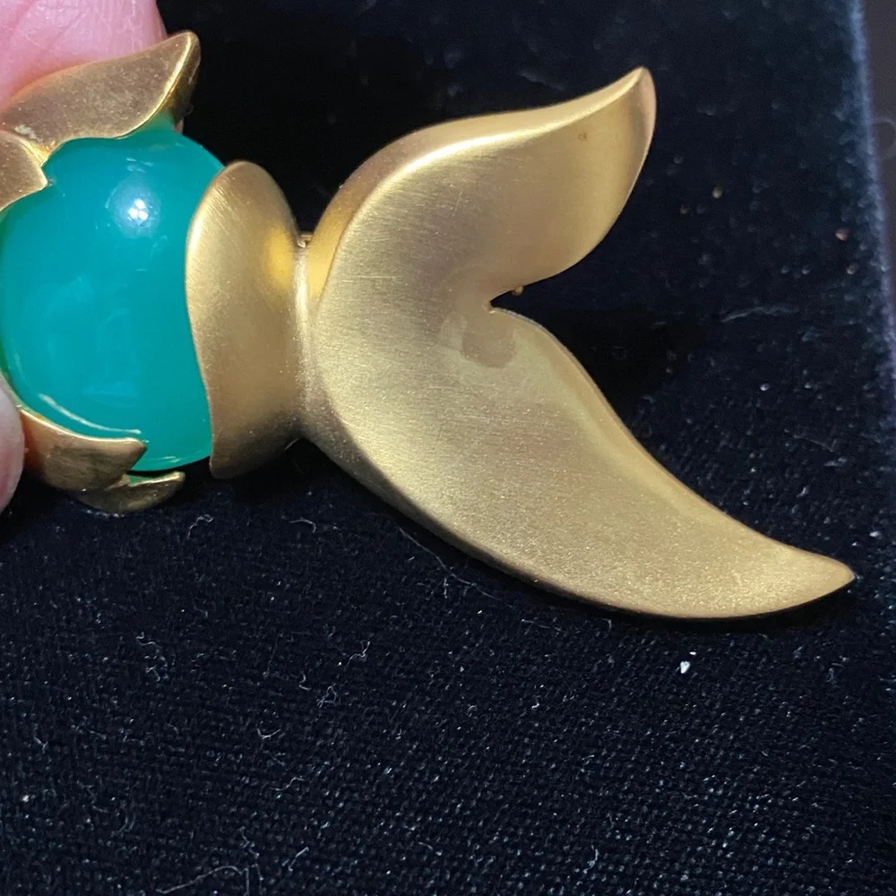Givenchy vintage Matt gold tone with faux jade belly and eye brooch