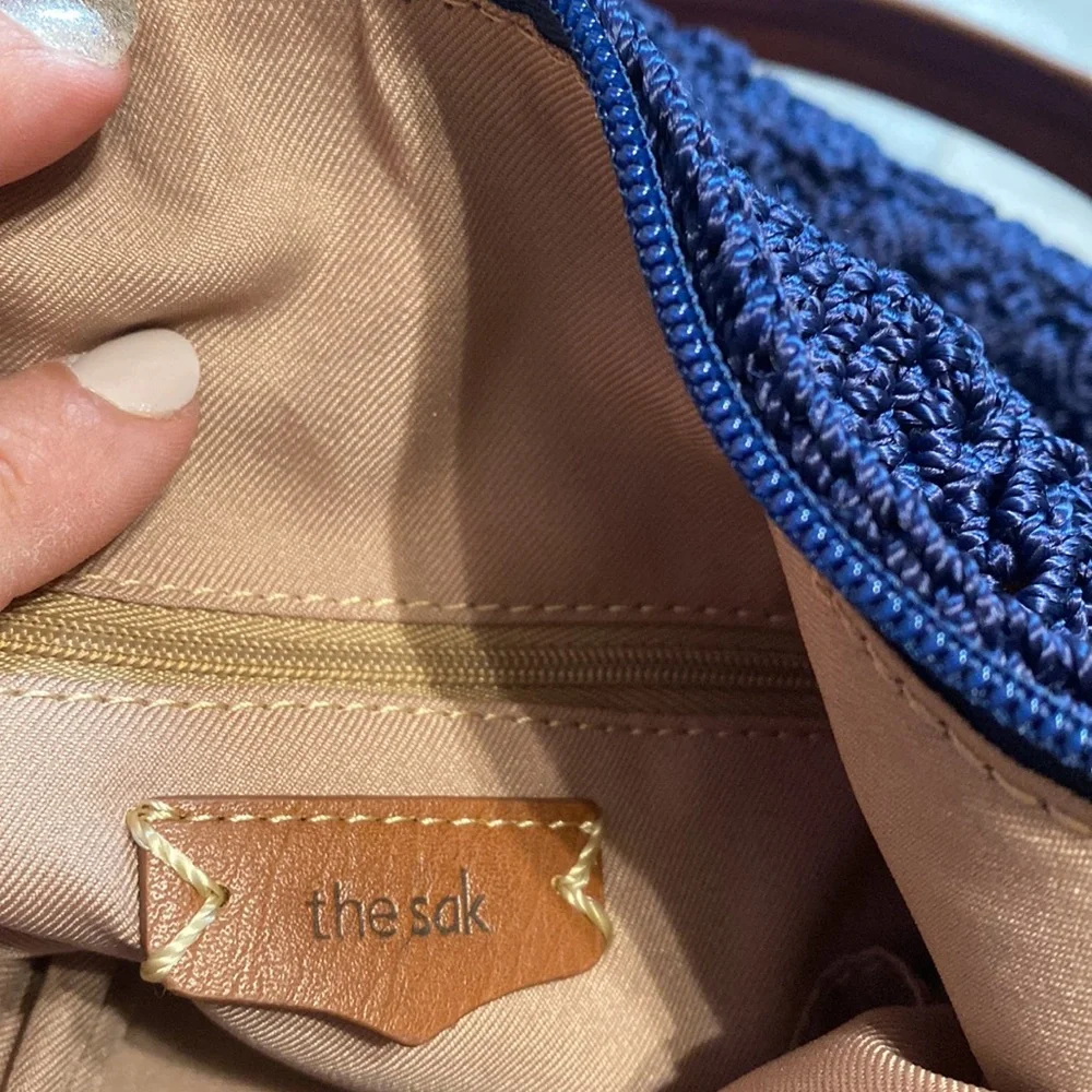 The Sak Navy Crochet Shoulder Bag with Brown Leather Straps
