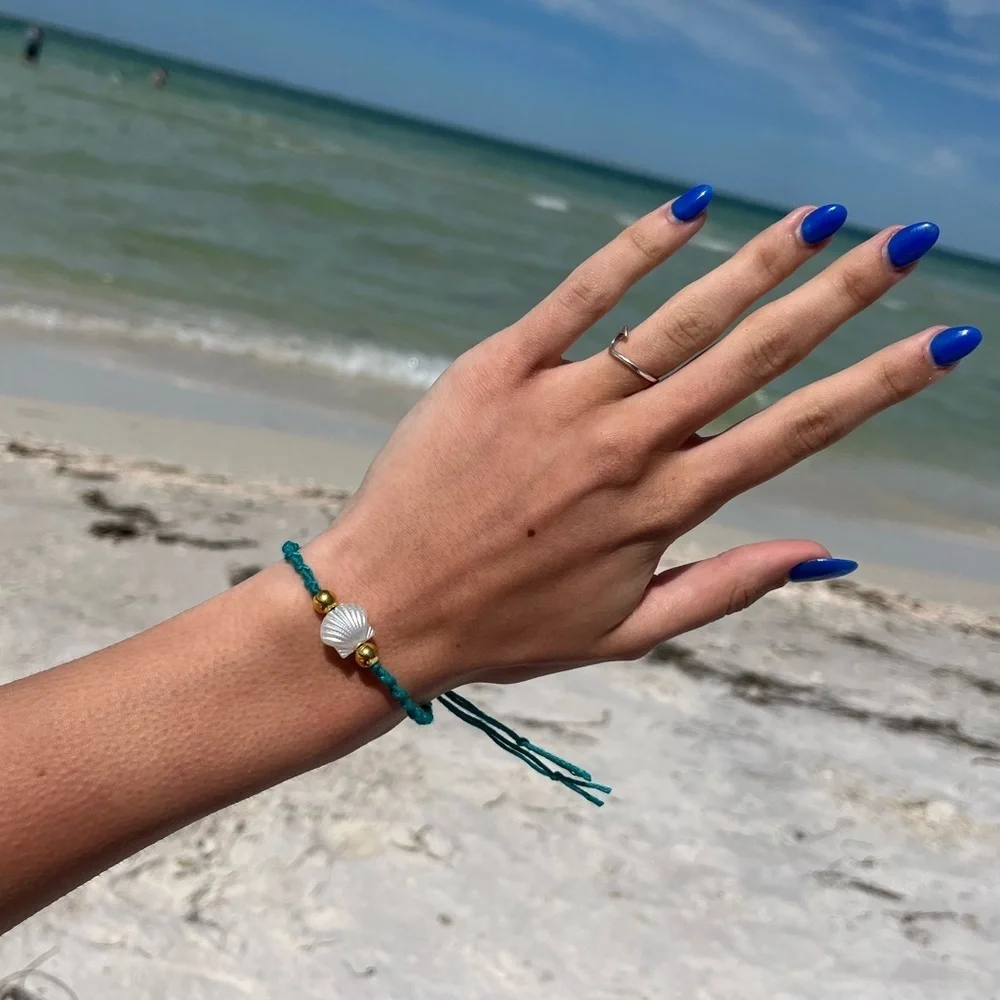 Handmade woven teal pearl shell gold bead bracelet