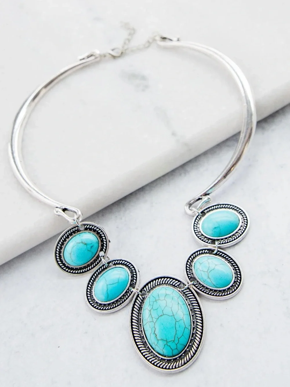 Silver necklace with oval turquoise stones