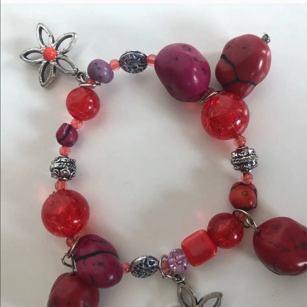 Handcrafted artisan red and burgundy stones paired with silver flowers bracelet