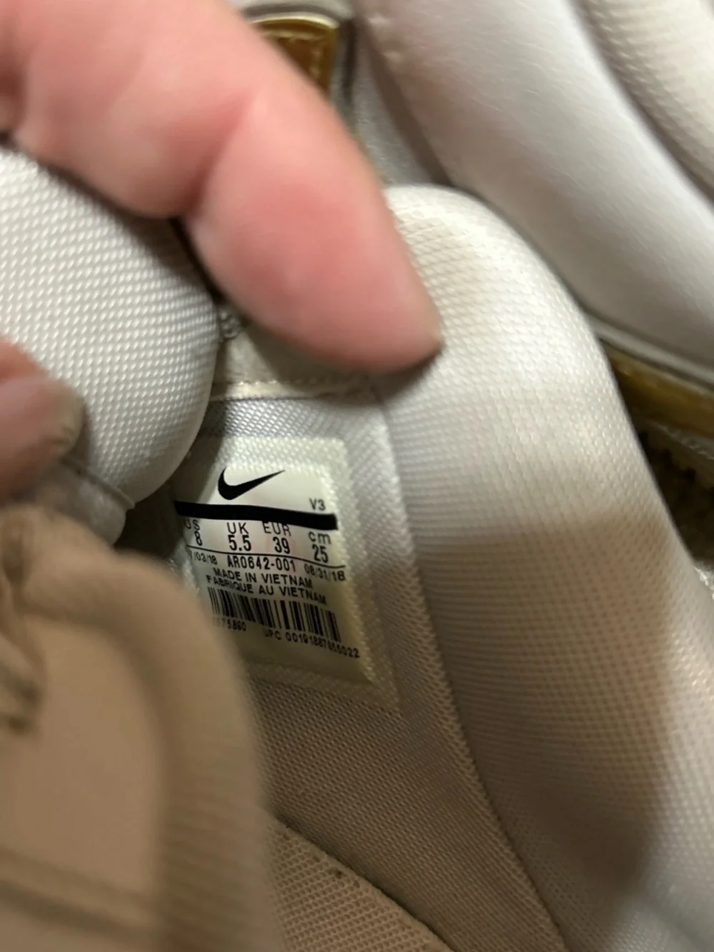 Nike White Athletic Shoes with Gold Swoosh