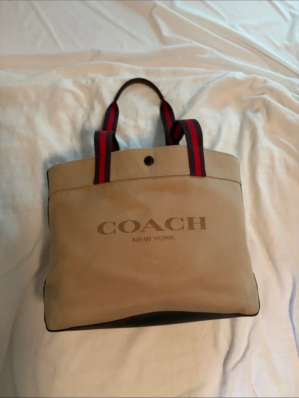 Coach 38” Canvas Duffel Tote in Tan with Red-Trim Handles with original tag.