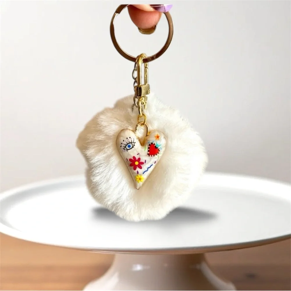 🎅🏻 SALE! White Fuzzy ball with heart charm bag charm Or key chain brand new